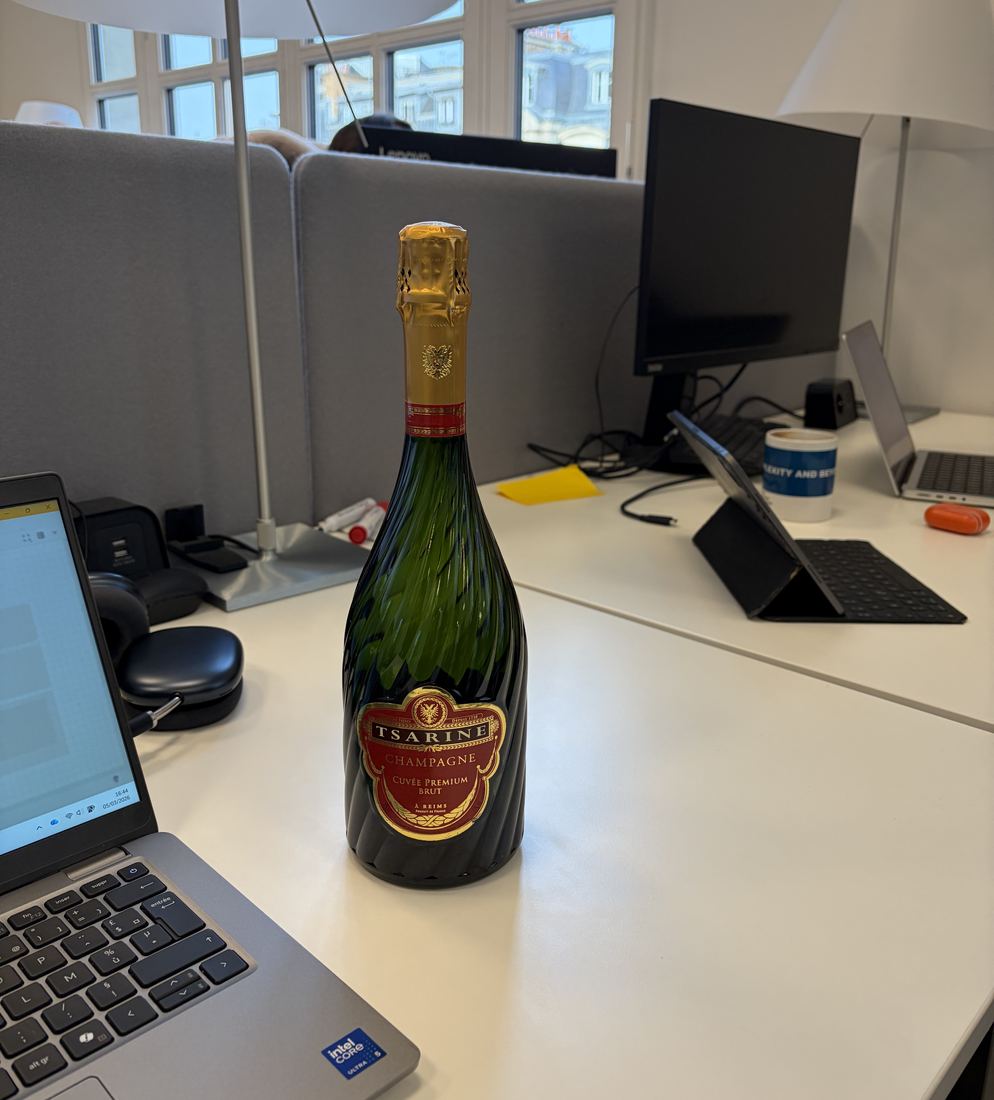 Bottle of champagne on a desk at the Kering office